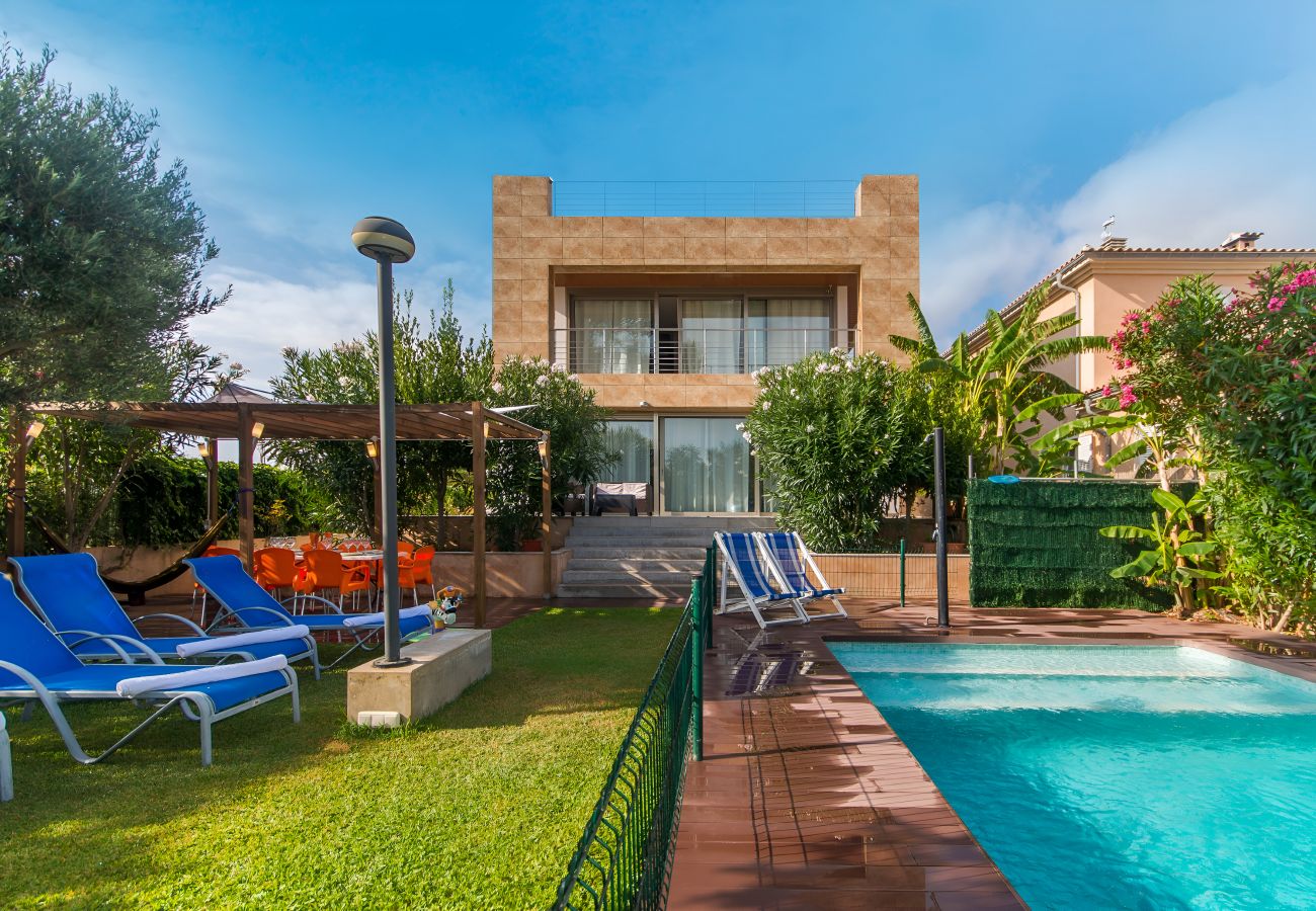 Villa Isabel in Mallorca with an outdoor garden and fenced pool